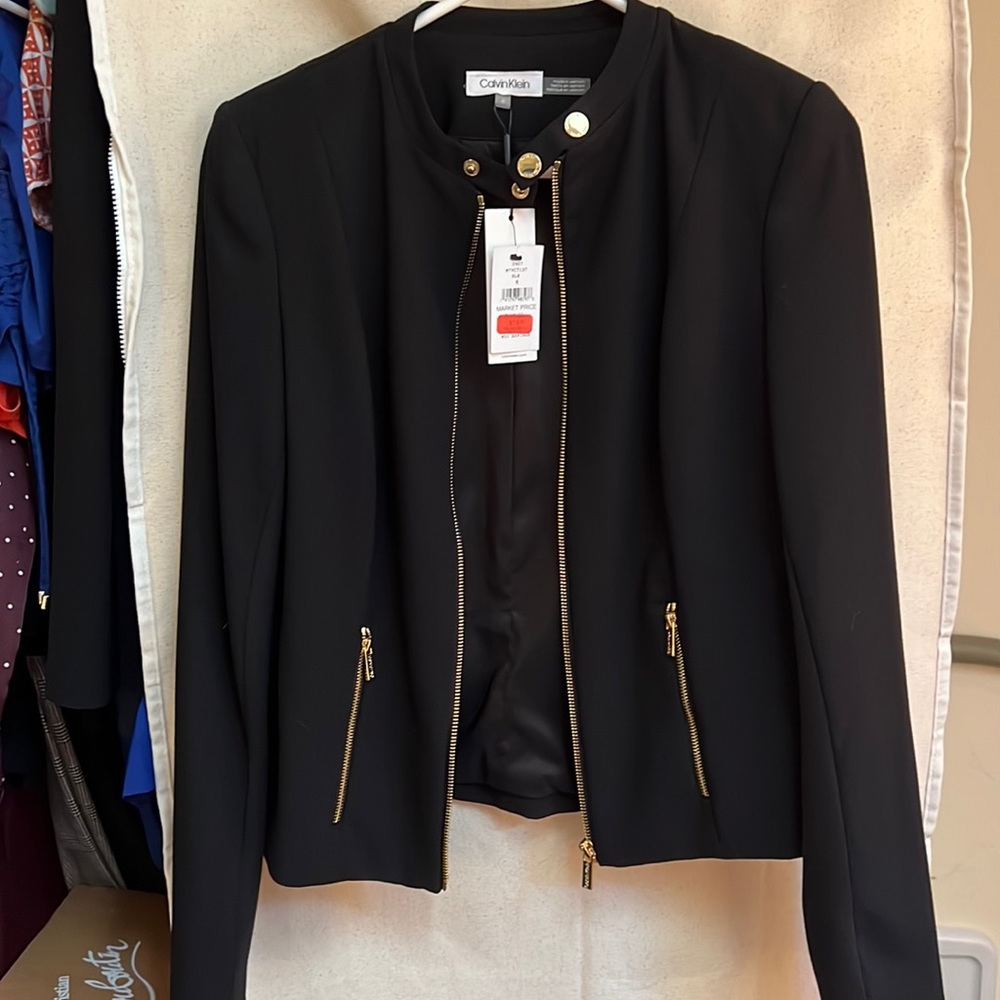 CK blazer with button.